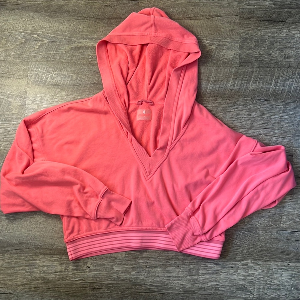 FP Movement by Free People Cropped V-Neck Hoodie in Coral Pink